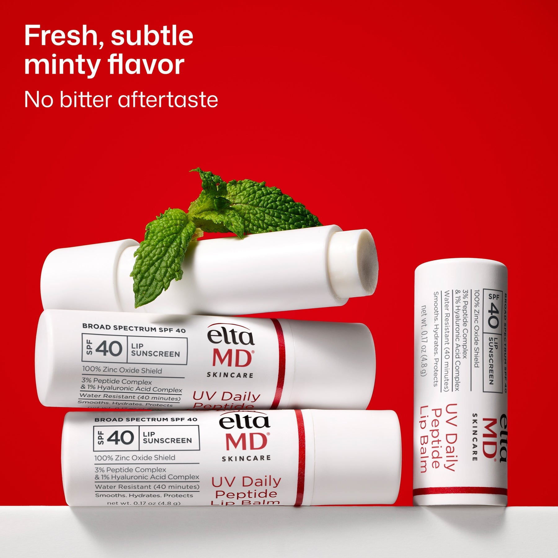 EltaMD UV Daily Peptide Lip Balm SPF 40 with fresh mint leaves highlighting its subtle mint flavor and no bitter aftertaste.