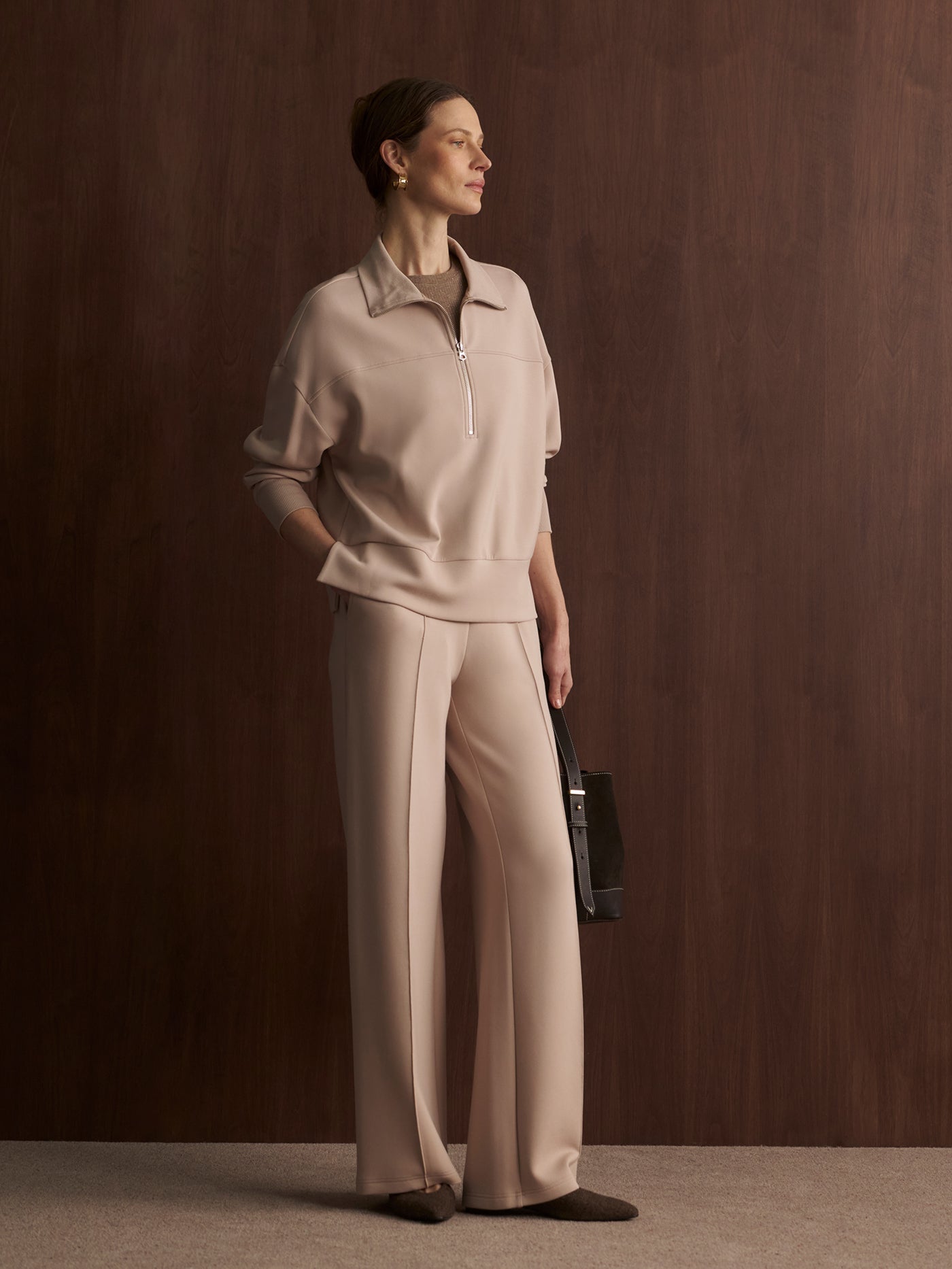 Model wearing the Varley The Wide Leg Pant 28" in Mushroom, front view.
