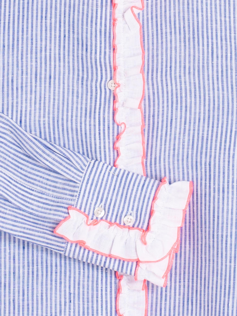 Close-up of the Vilagallo Pia Shirt in baby blue, highlighting the white ruffle cuffs with pink trim.