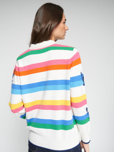 Back view of a model wearing the Vilagallo Happy Langoustine Sweater with multicolored stripes.