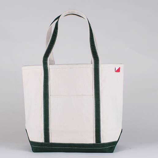 Back view of the heavyweight natural canvas tote with dark green trim.