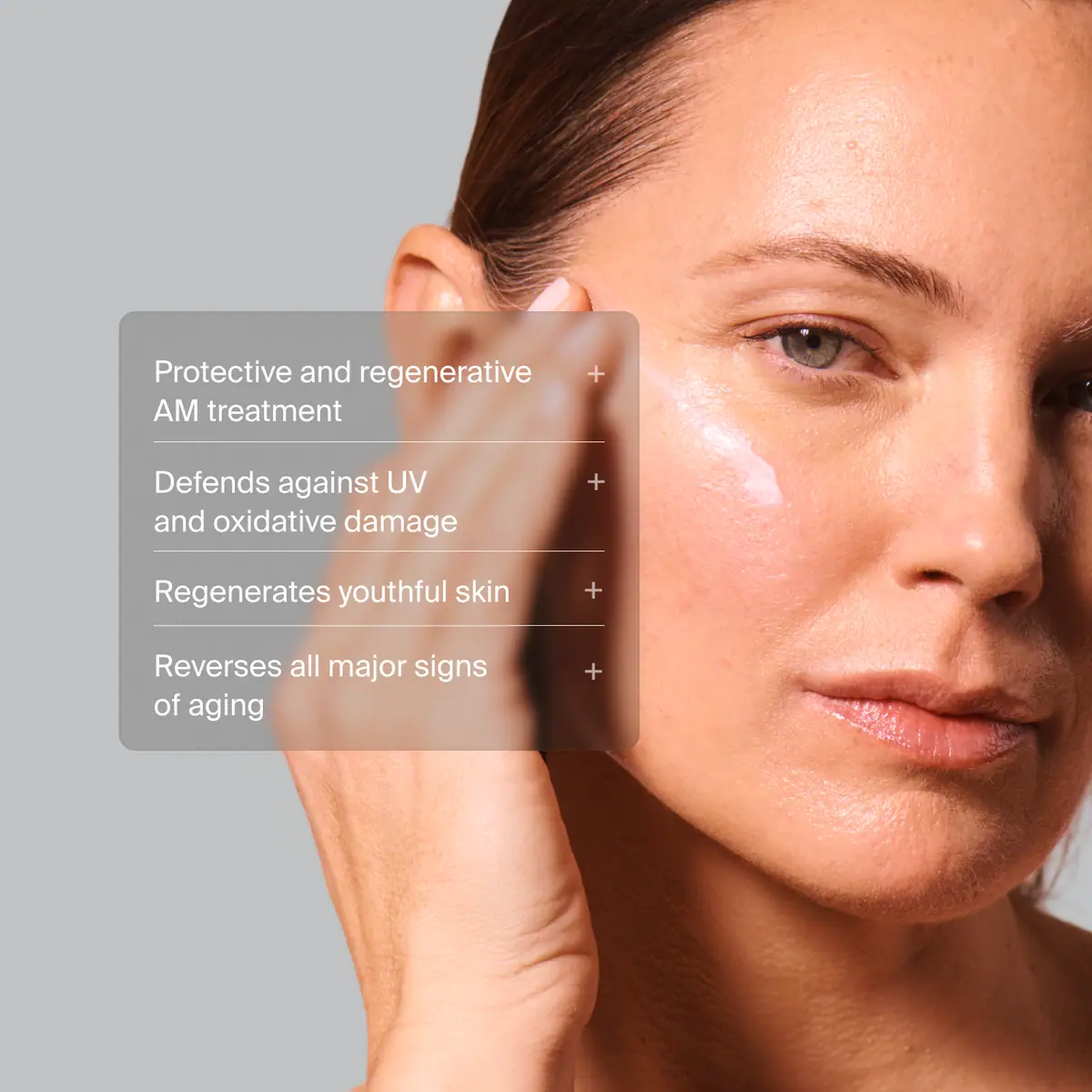 Close up of woman applying Pavise Dynamic Age Defense protective and regenerative AM treatment to defend against UV and oxidative damage, regenerate youthful skin and reverse all major signs of aging.