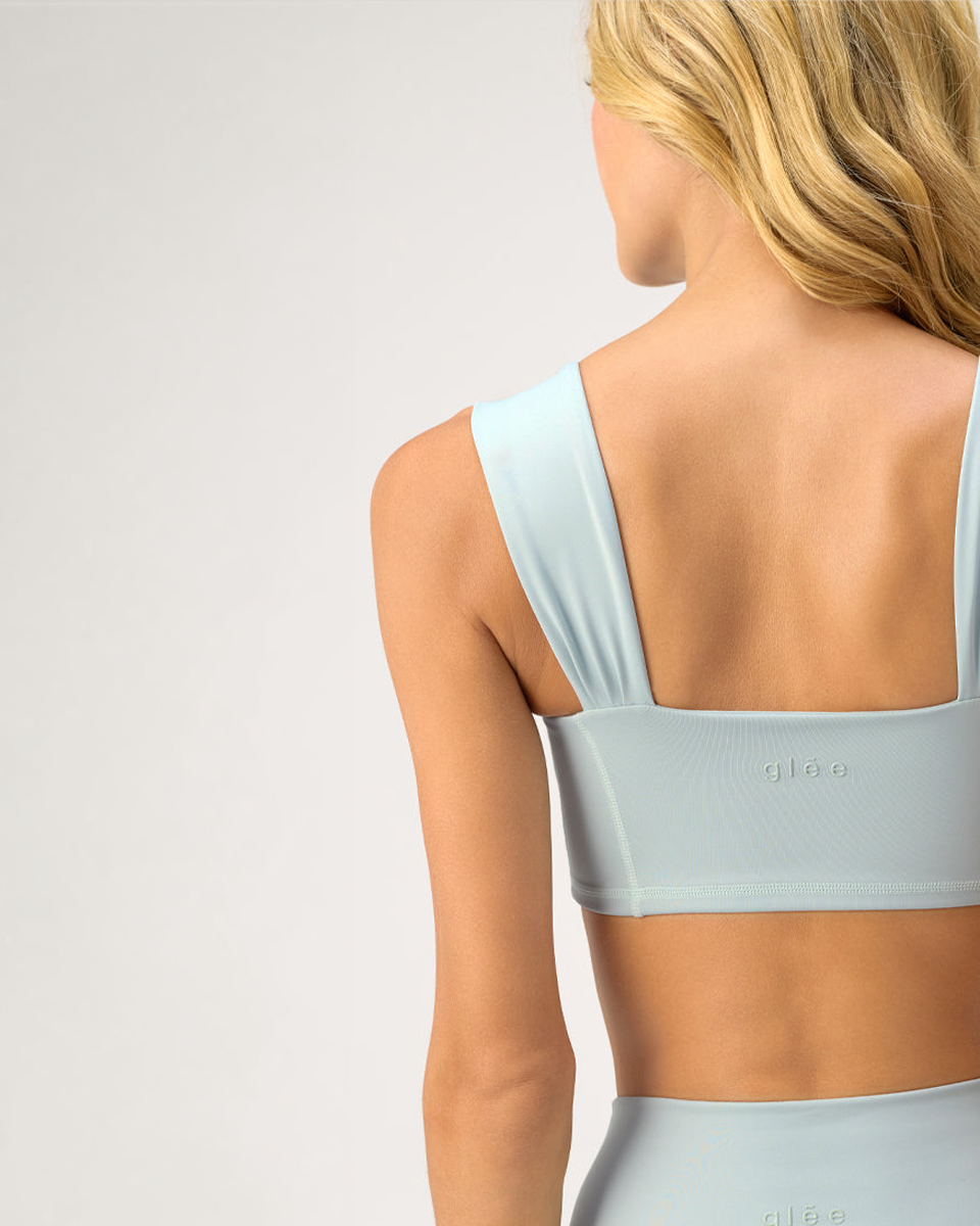 Close-up of the Glee x Be Fit Enchanted Sea Top in Sea Form, highlighting the back straps and supportive design.