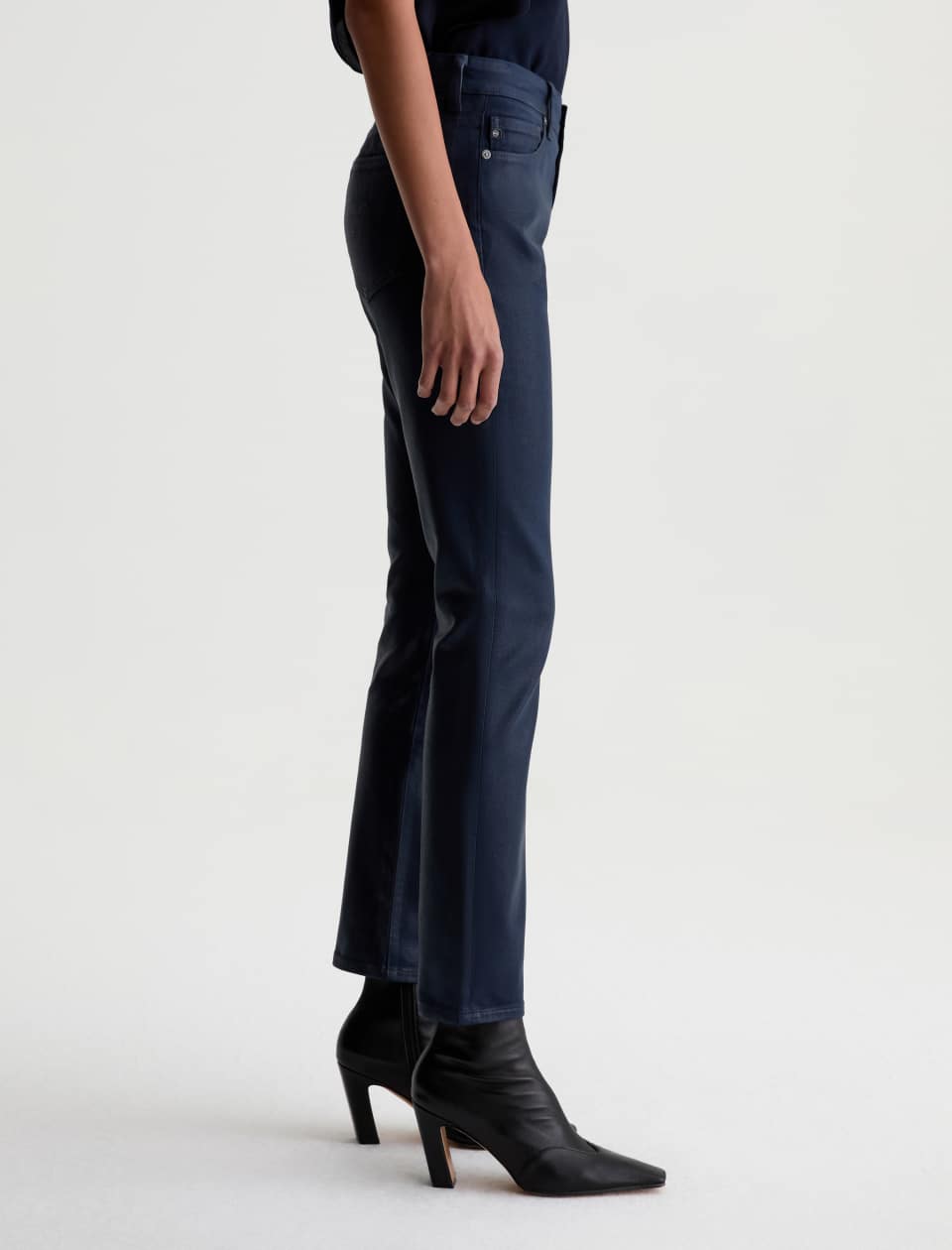 Side view of the AG Mari Coated Jean on a model, showing the fit from waist to hem.