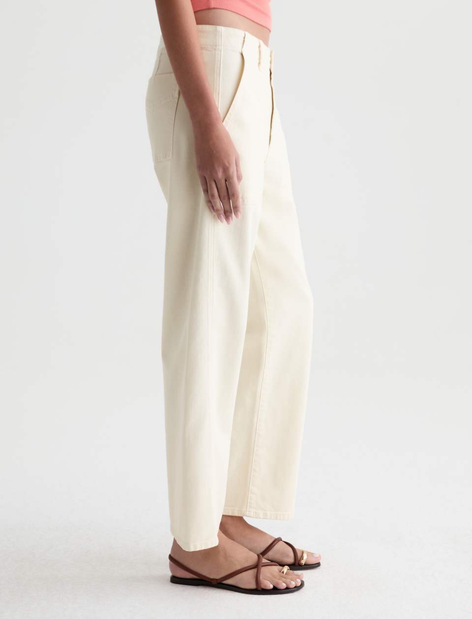 Side view of the Analeigh Utility Pant on a model, showing the leg shape and ankle-length hem.