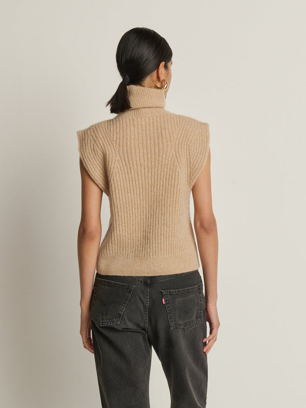Back view of a model wearing the Nation Los Angeles Isha Turtleneck Tank in Shiny Moonbeam.