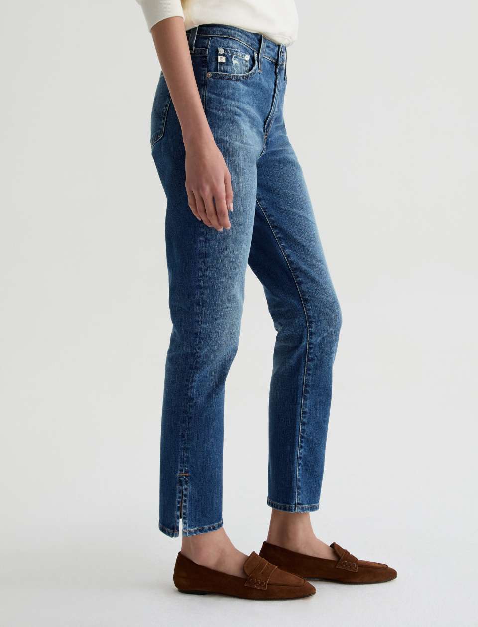 Angled side view of model wearing Mari Crop Jean in 15 Years Prague by AG Jeans.
