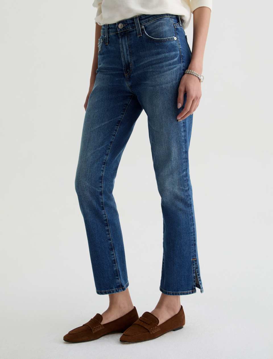 Angled side view of model wearing Mari Crop Jean in 15 Years Prague by AG Jeans.