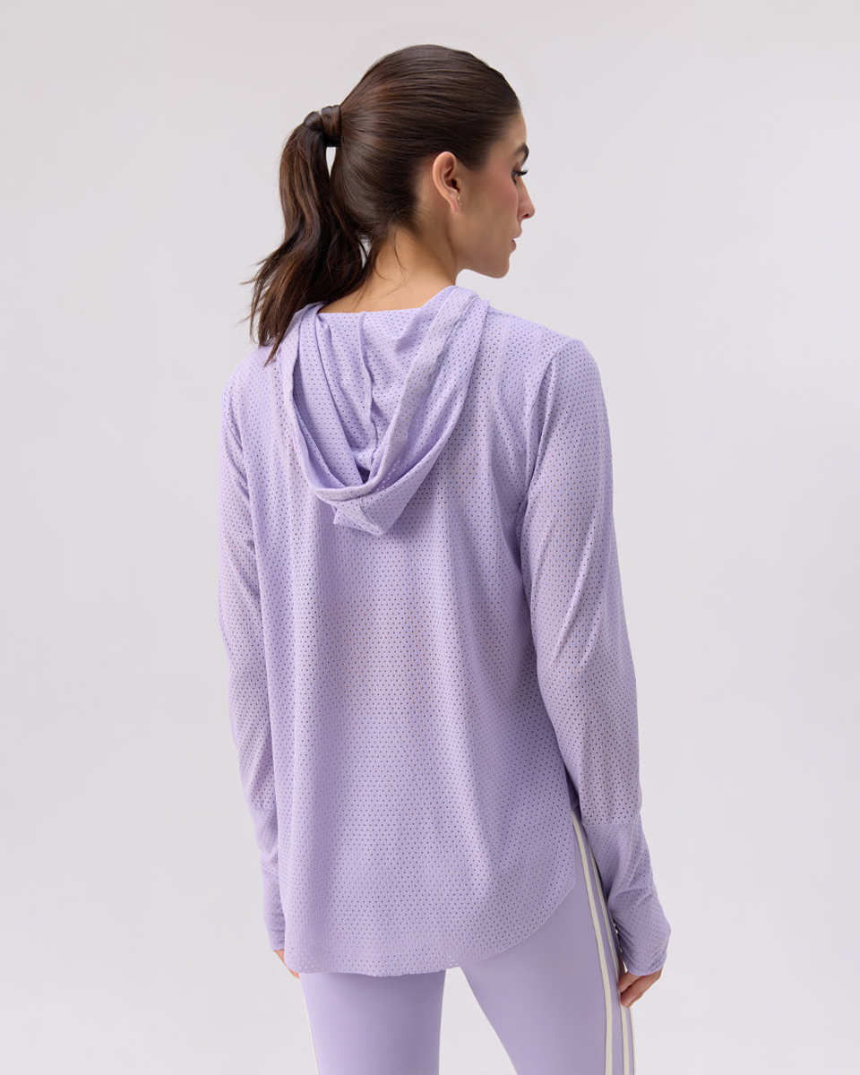 Woman wearing a Glee x Be Fit lilac colored hoodie and pants on a white background