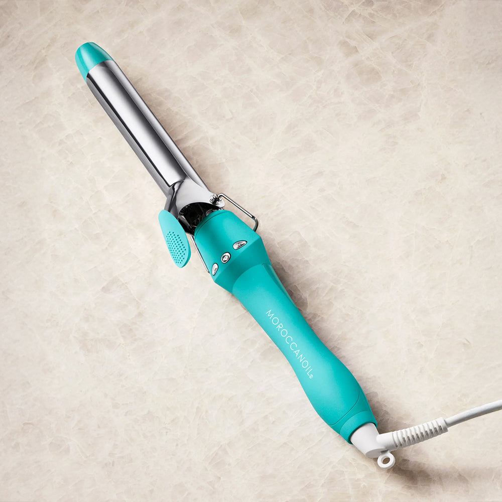Turquoise Moroccanoil Everlasting Curl Titanium Curling Iron with an extra-long 1-inch titanium barrel for creating curls and waves.