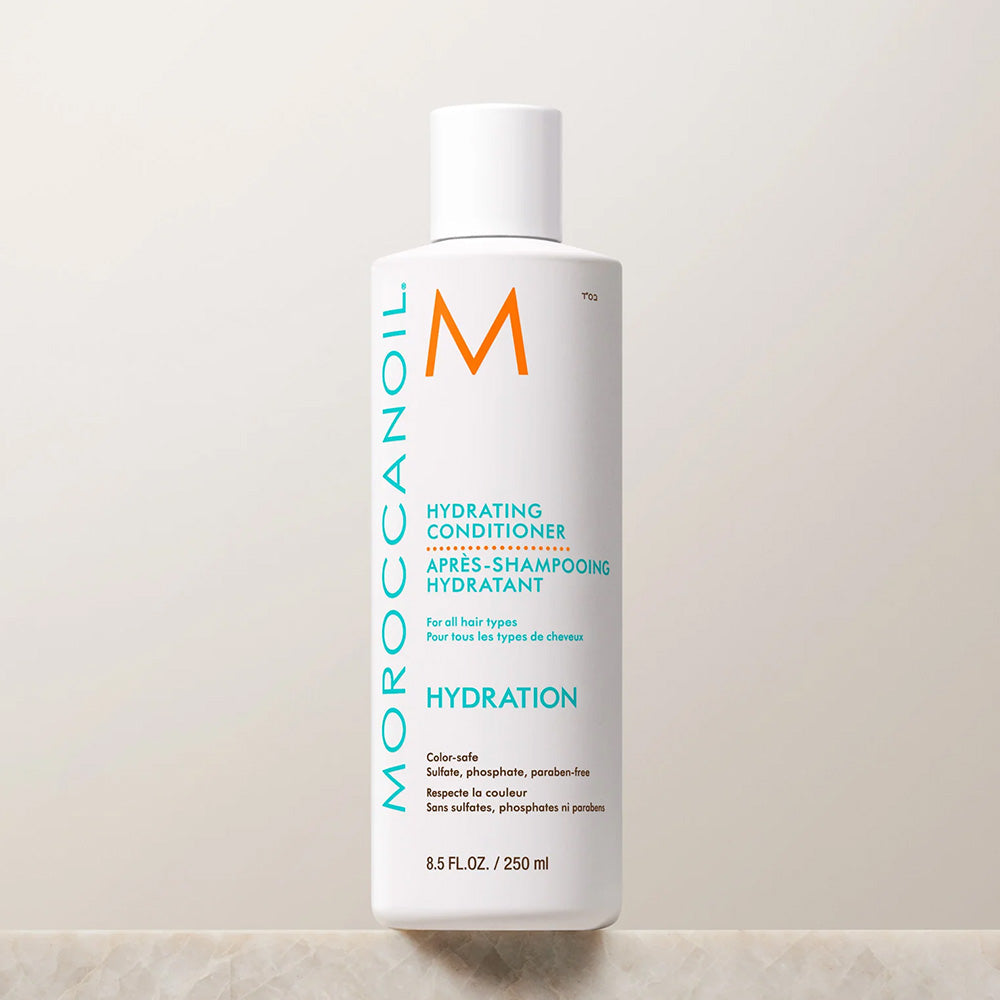 A white bottle of Moroccanoil Hydrating Conditioner for all hair types; color-safe; sulfate, phosphate, and paraben-free; 8.5 fl oz.