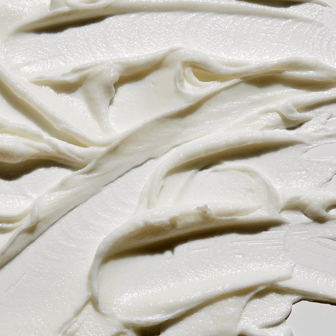 Jack Black Face Buff Scrub close-up showing the creamy facial exfoliator texture and fine scrubbing particles.