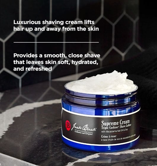 Open jar of Jack Black Supreme Cream with text highlighting a smooth, close shave that leaves skin soft, hydrated and refreshed.