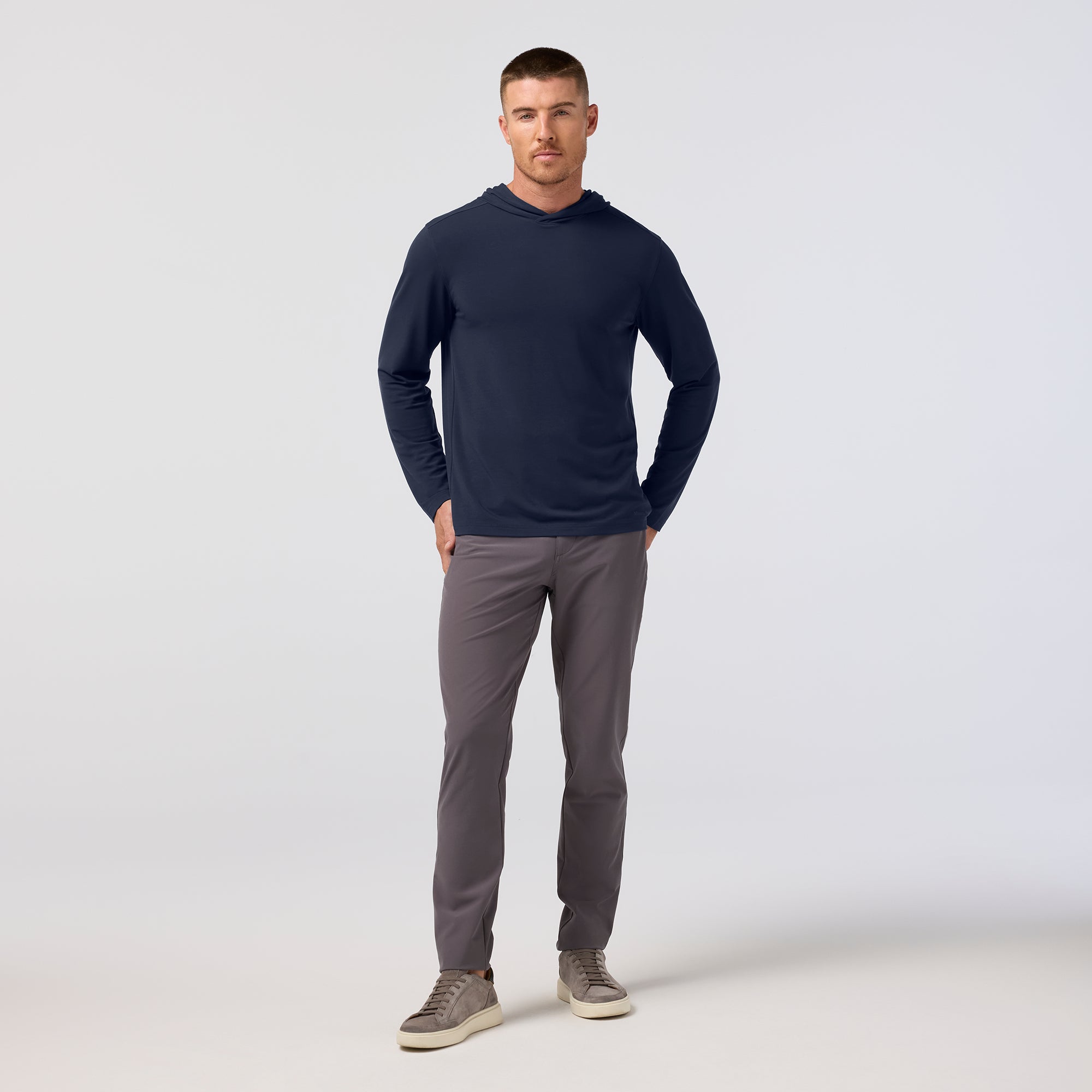 Model wearing the Mizzen+Main Knox Hoodie in Navy, showing the fit and attached hood.