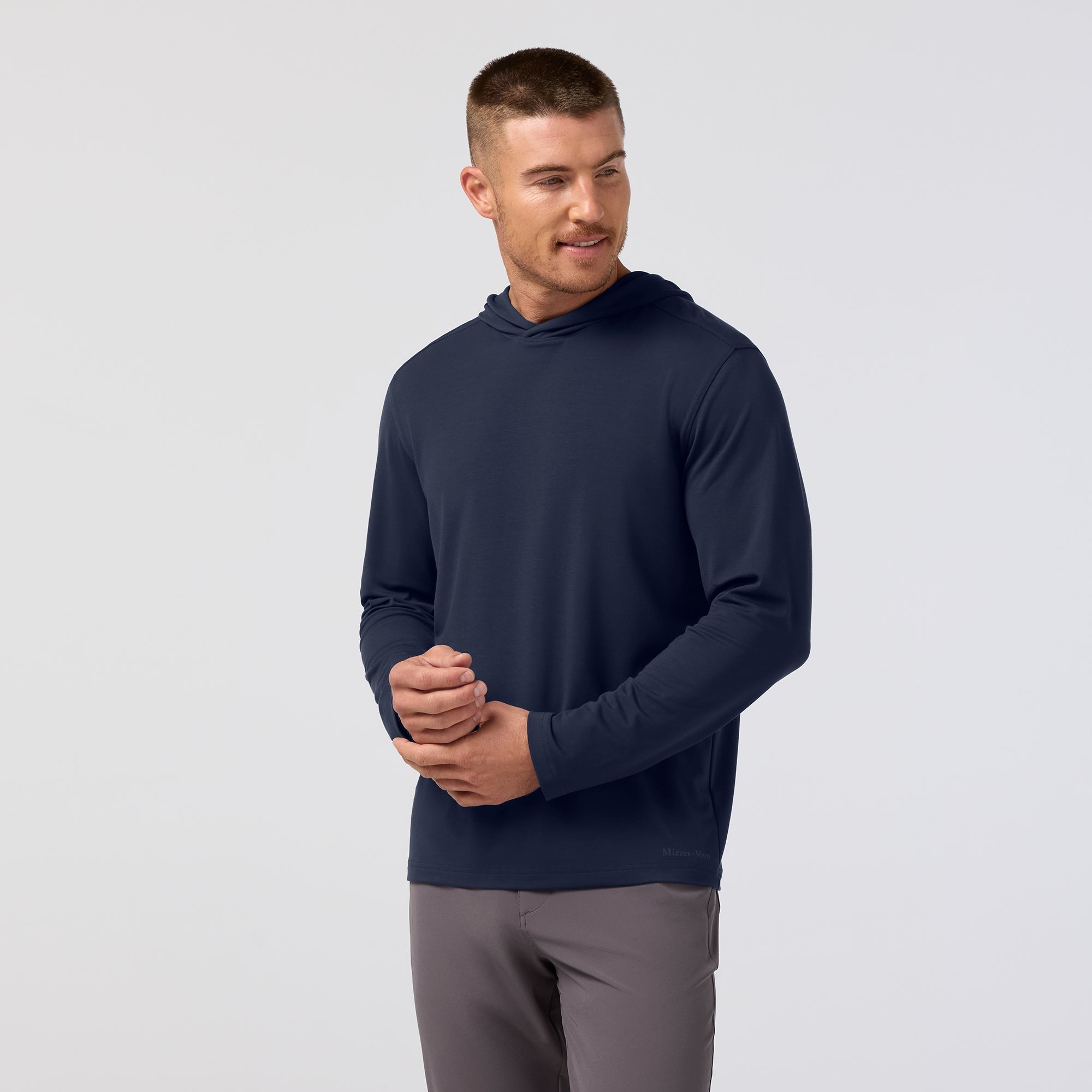 Front view of the Mizzen+Main Knox Hoodie in Navy, highlighting the fit and attached hood.