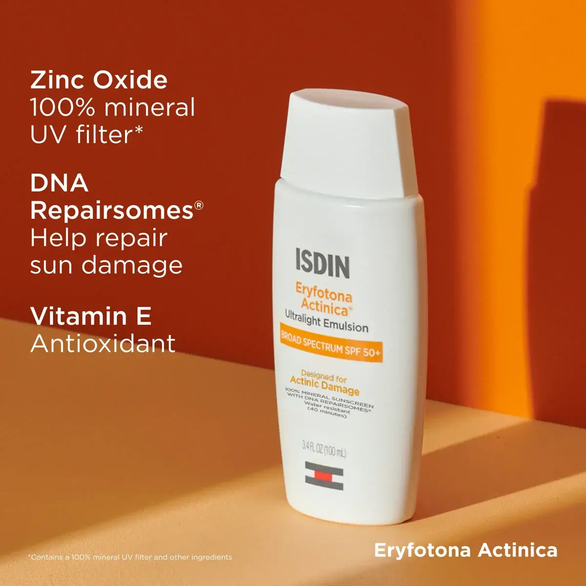 Bottle of ISDIN Eryfotonoa Actinica SPF 50+ in an orange background setting with zinc oxide, DNA repairsomes to help repair sun damage, and vitamin E.
