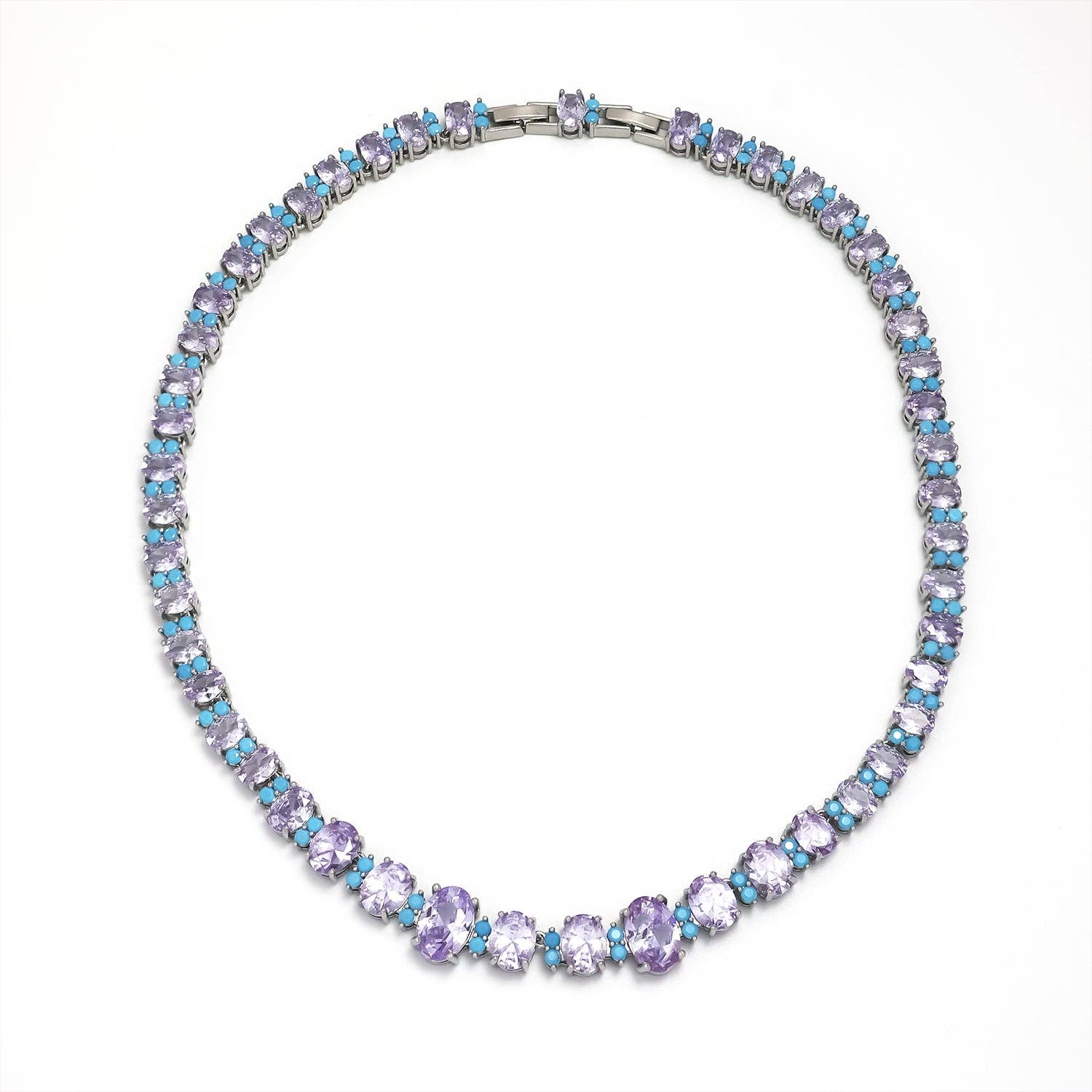 Full view of the Simply Jewels silver-tone tennis necklace featuring alternating oval teal and purplecubic zirconia stones.