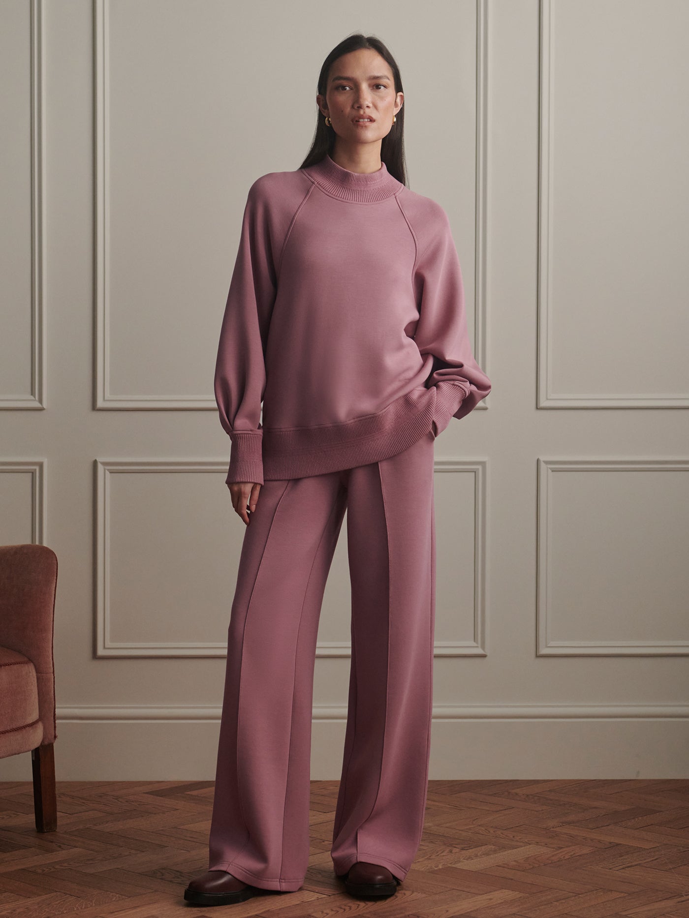 Model wearing the Varley The Wide Leg Pant 30" in Wistful Mauve, front view.