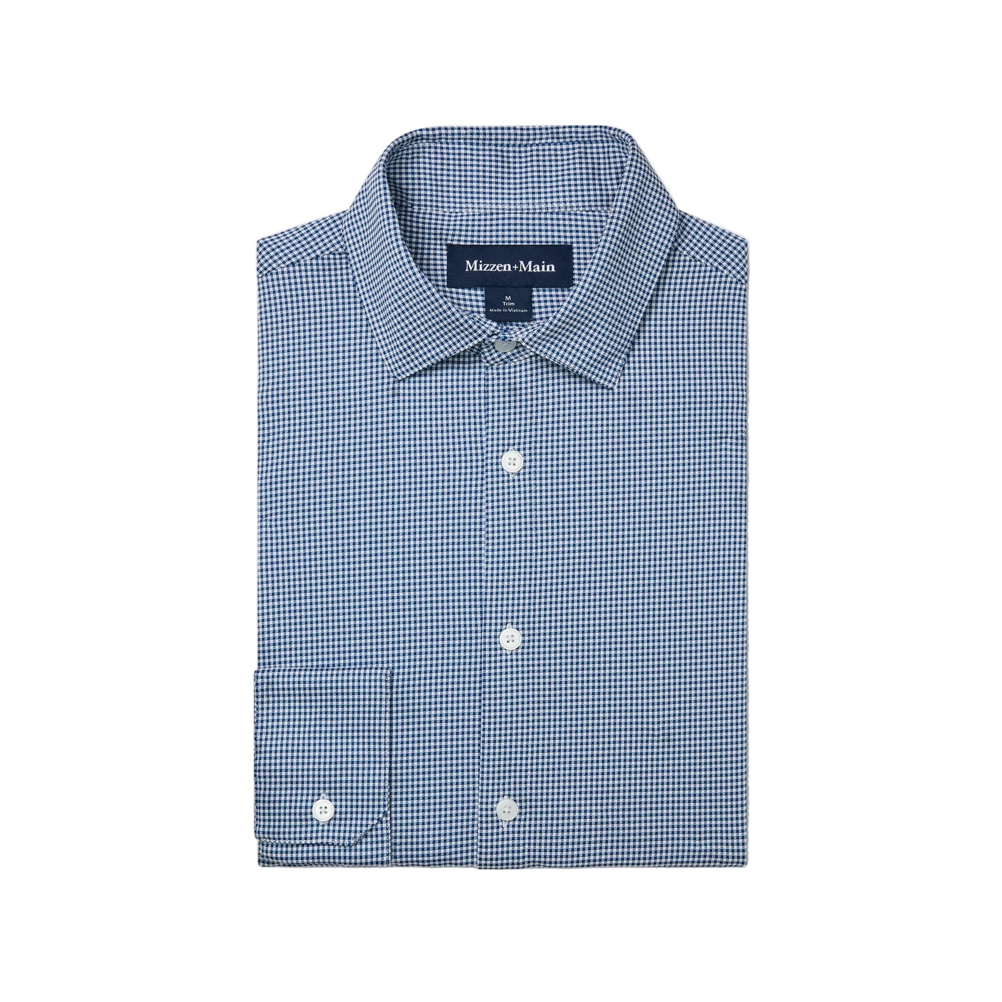Folded Mizzen+Main Long Sleeve Dress Shirt in Navy Peter Gingham, men's performance button-down shirt with a navy gingham pattern.