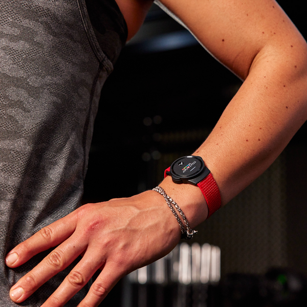 Close-up of the MYZONE MZ-Switch heart rate monitor on wrist.