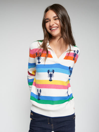 Model wearing the Vilagallo Happy Langoustine Sweater with multicolored stripes and lobster intarsia, front view.