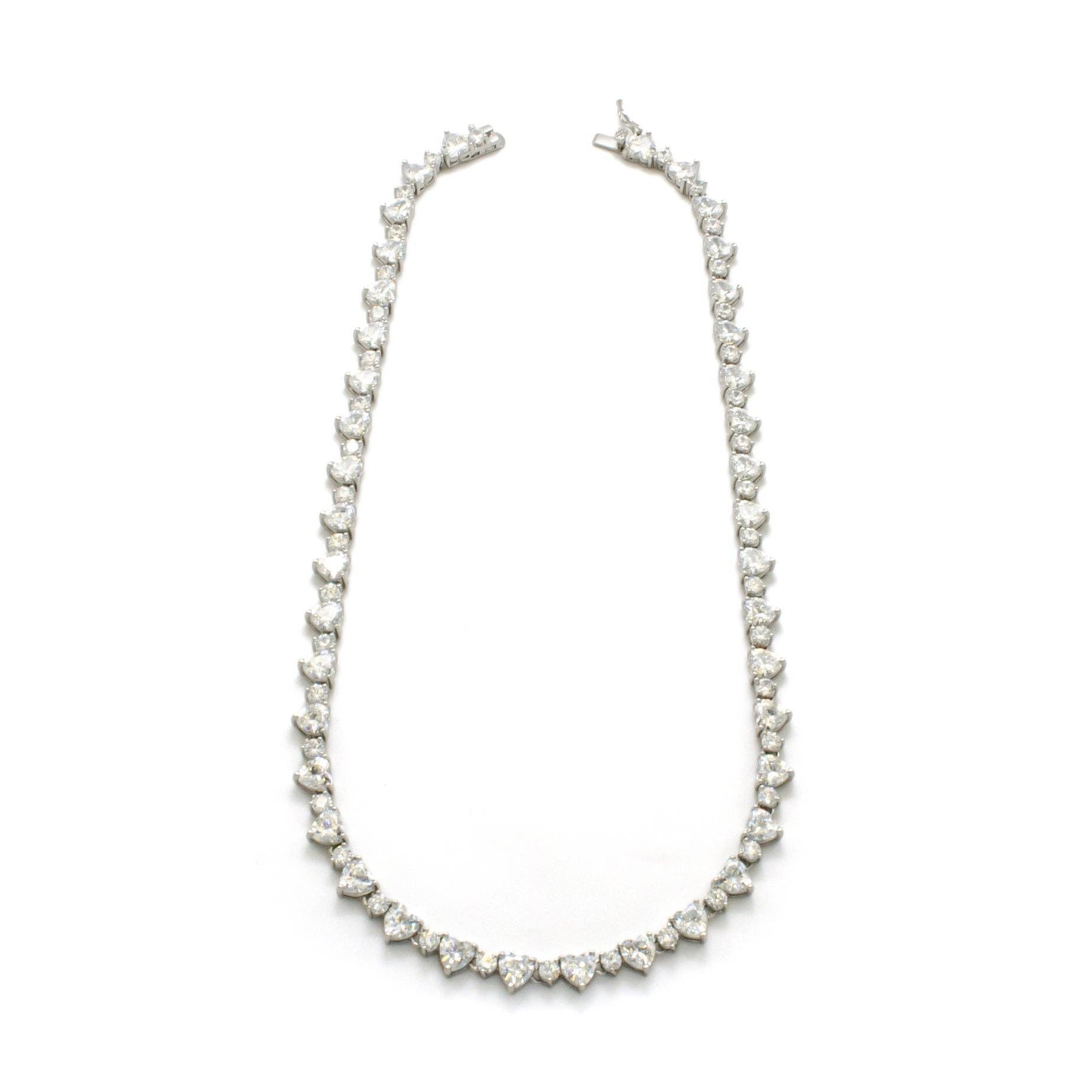 Silver-tone heart tennis necklace featuring cubic zirconia stones and a rhodium-plated finish.