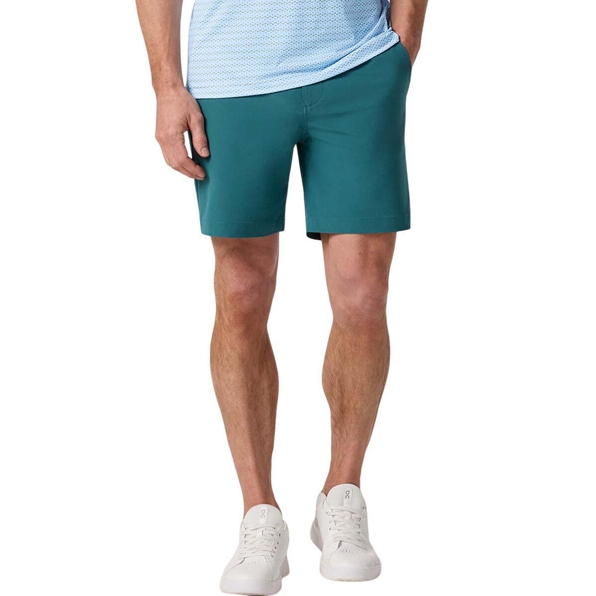 Front view of a model wearing Mizzen+Main Helmsman Short in Balsam (deep green), showing the fit and length.