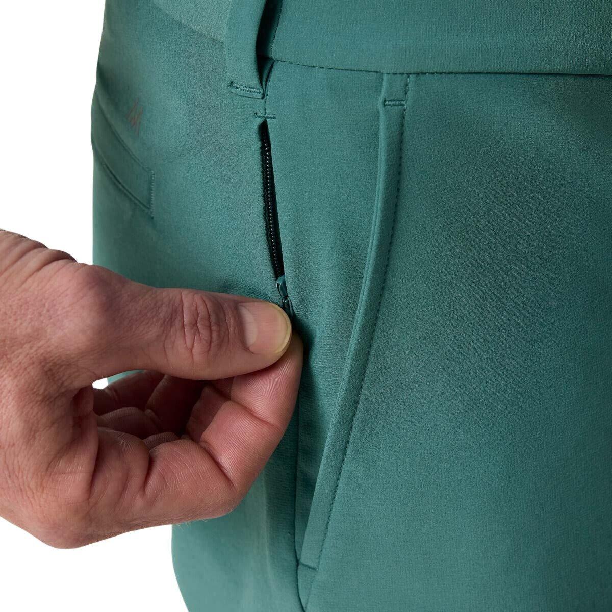 Close-up of the front pockets and zippered auxiliary side pocket on the Mizzen+Main Helmsman Short in Balsam (deep green).