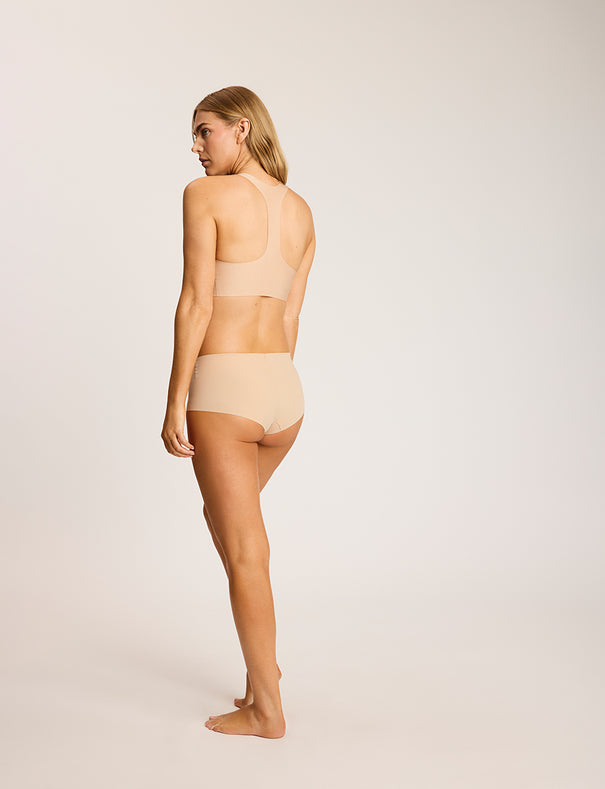 Back view of the Commando Classic Boy Short in Beige, showing the full-coverage boyshort silhouette and seamless construction.
