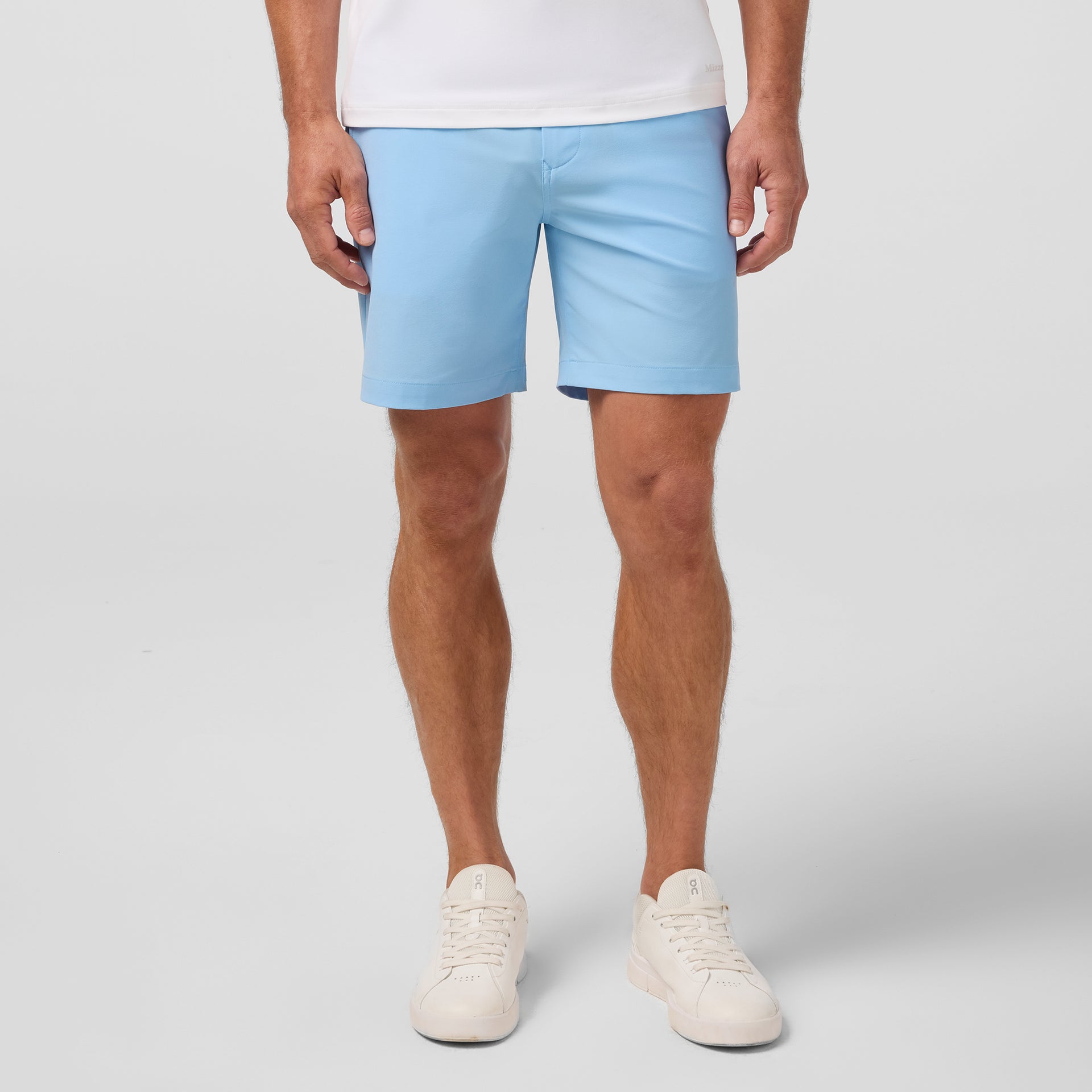 Model wearing Mizzen+Main Helmsman Short in Cloud Blue (light blue), shown from the front.