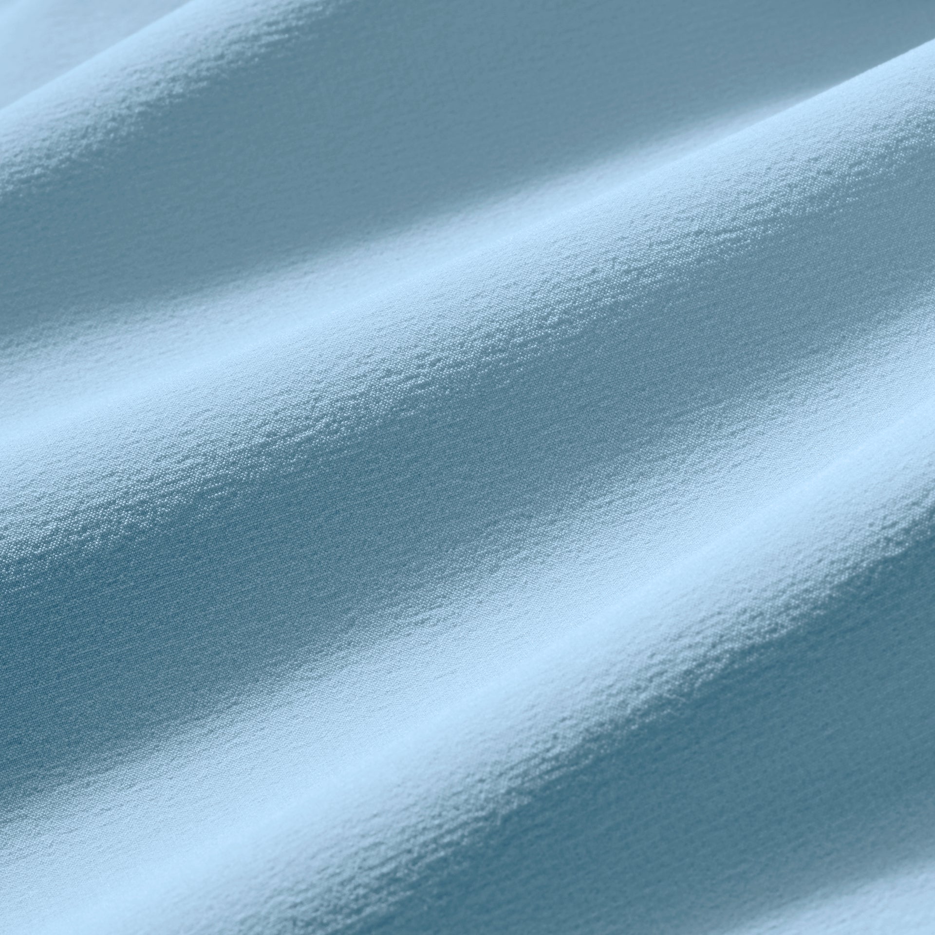 Close-up of the Mizzen+Main Helmsman Short performance fabric in Cloud Blue (light blue), highlighting the lightweight woven texture.