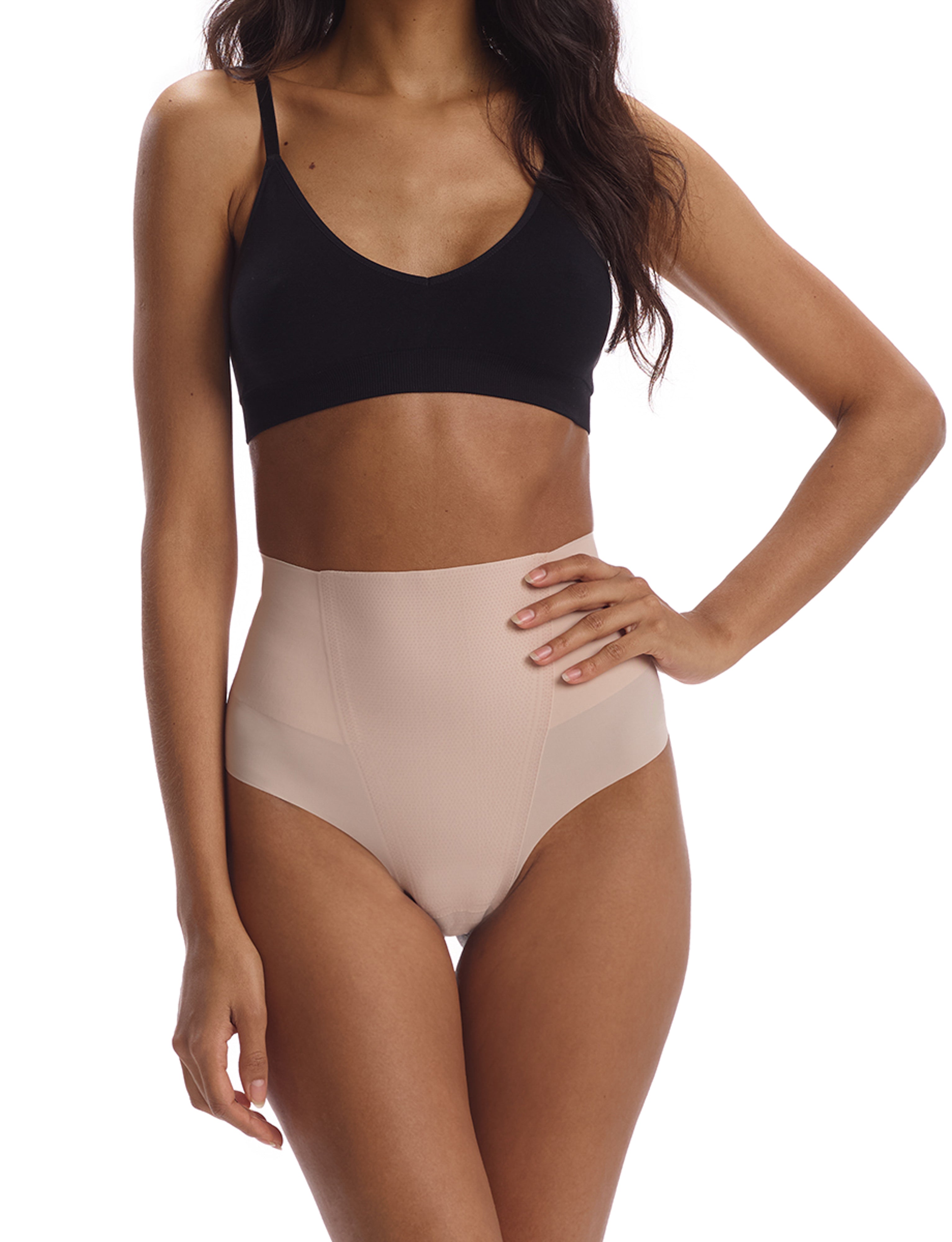 Close-up front view of the Commando Zone Smoothing Thong on a model, highlighting the super-high-rise waistband and smooth fit.