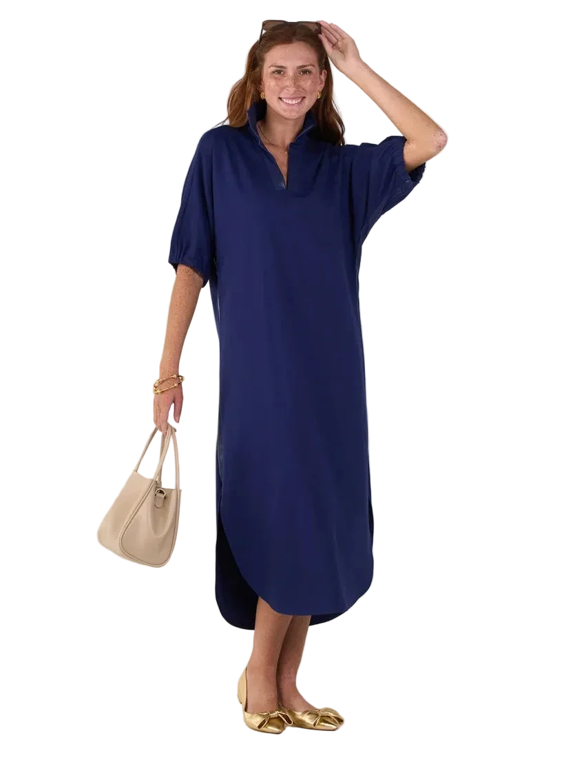 Emily McCarthy Poppy Caftan in Navy Ponte styled with gold flats and a neutral handbag, featuring a notched neckline and relaxed fit.