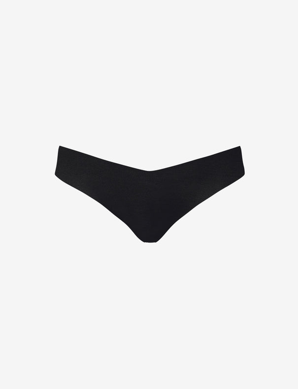 Commando Classic Thong in black on a white background.