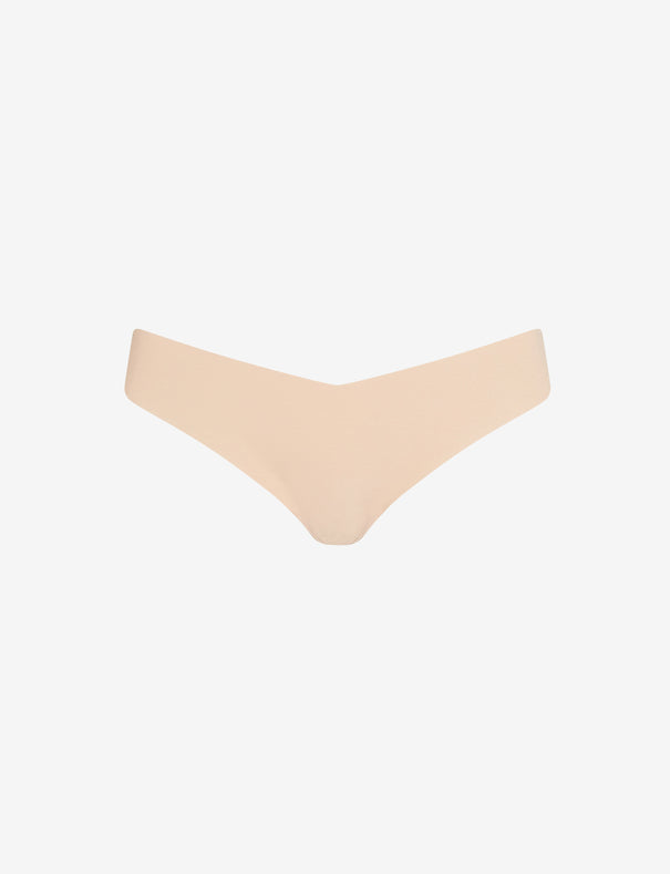 Commando Classic Thong in nude on a white background.