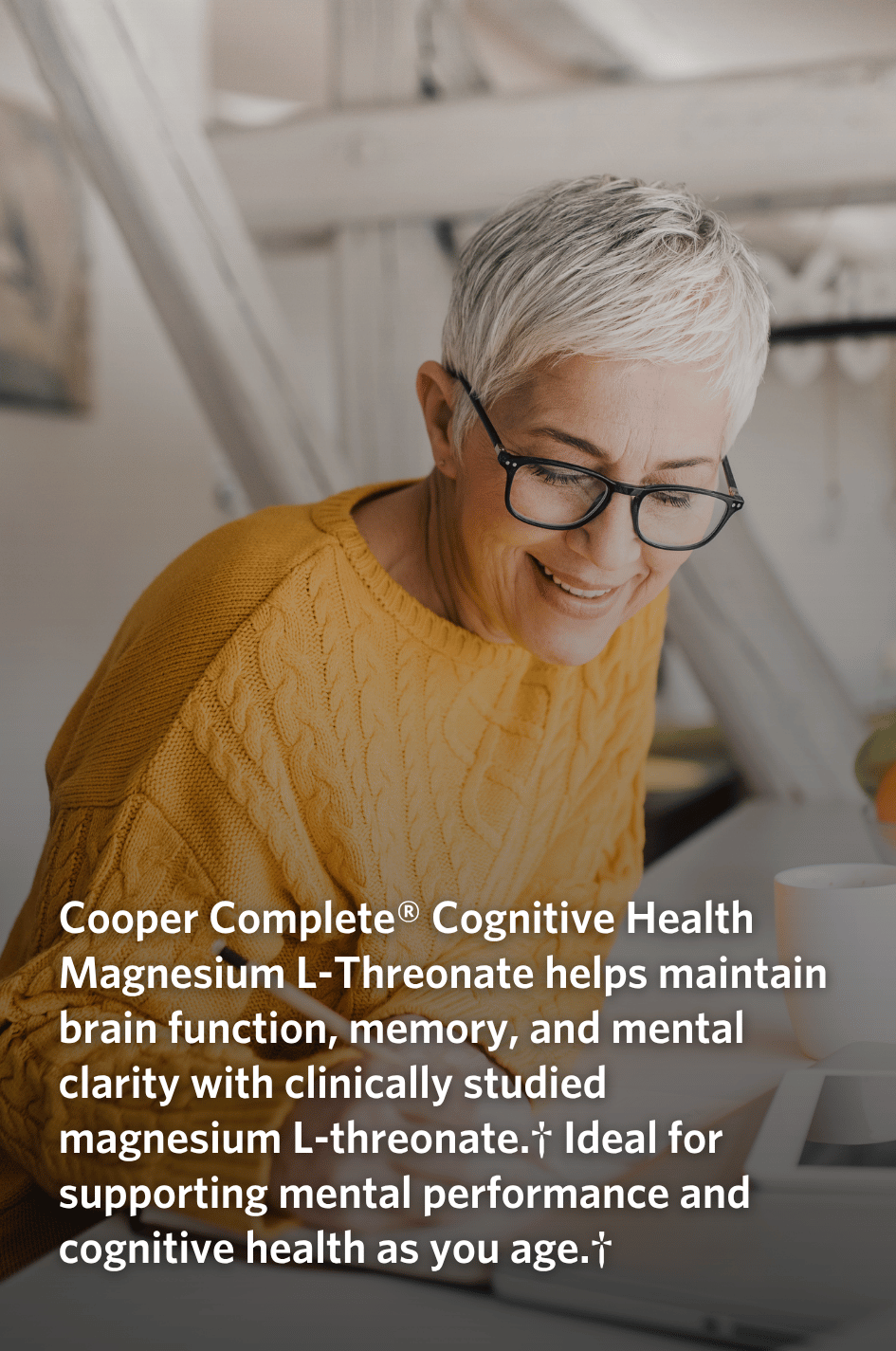 Woman wearing glasses and a yellow sweater, with text about Cooper Complete Cognitive Health Magnesium L-Threonate supplement.