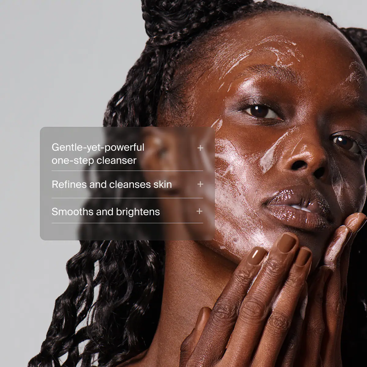 Close up of a woman applying Pavise Gentle Amino Power Wash gentle-yet-powerful one-step cleanser to smooth, brighten, refine and cleanse skin. 