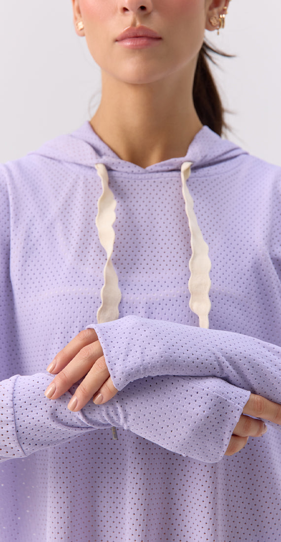 Close-up front view of the Glee x Be Fit Lilac Hoodie, highlighting the extended cuffs with thumbholes.