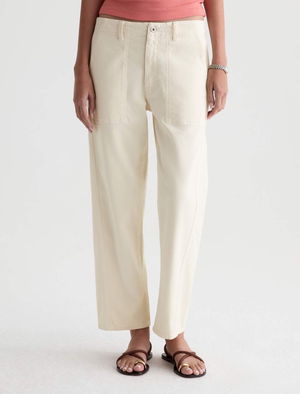 Front view of the Analeigh Utility Pant on a model, showing the mid-rise waistband, utility pockets and ankle-length legs.