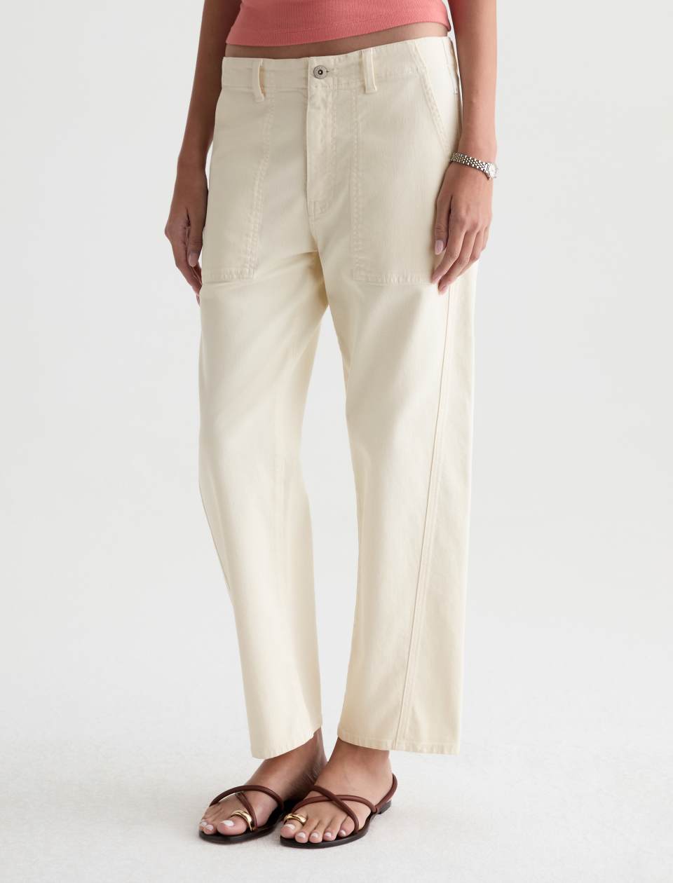 Angled front view of the Analeigh Utility Pant, showing its off-white denim and straight-leg fit.