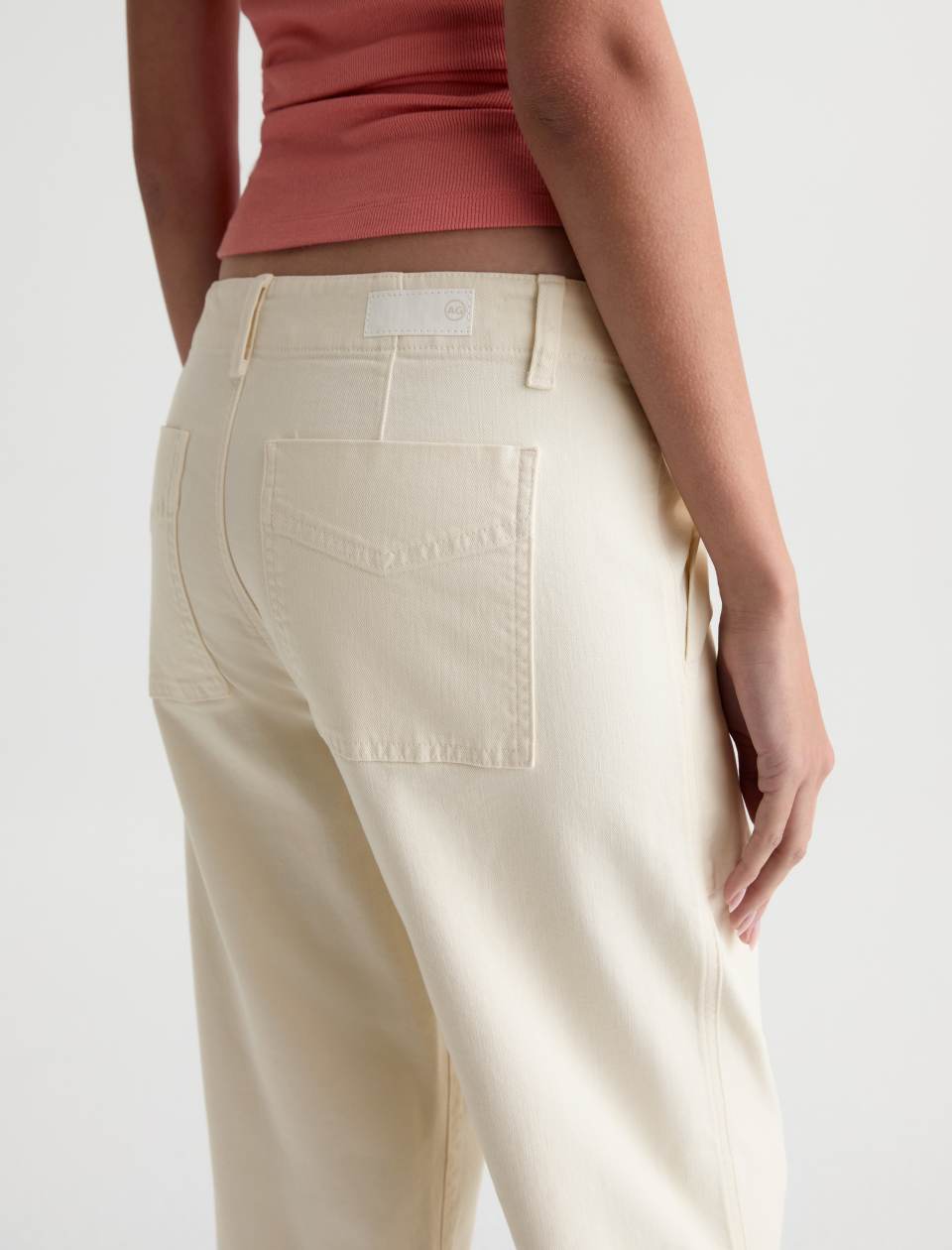 Close-up of the Analeigh Utility Pant’s back pocket and AG waistband label.