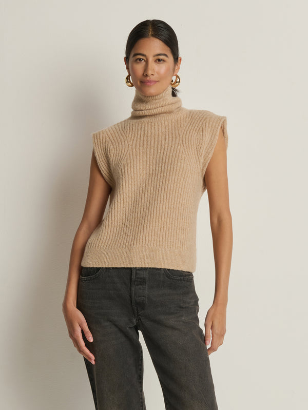 Model wearing the Nation Los Angeles Isha Turtleneck Tank in Shiny Moonbeam, front view.