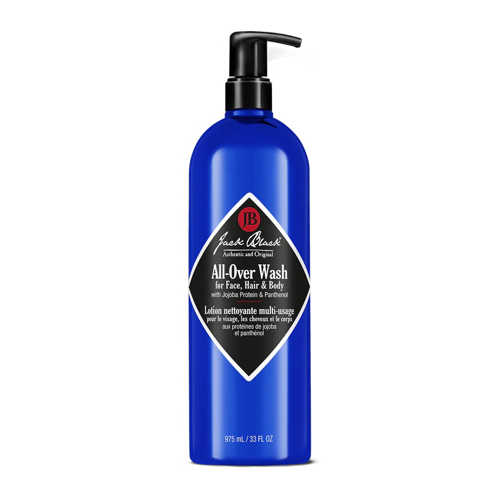 A blue pump bottle of Jack Black All-Over Wash for face, hair, and body with jojoba protein and panthenol, 33 fl oz. 