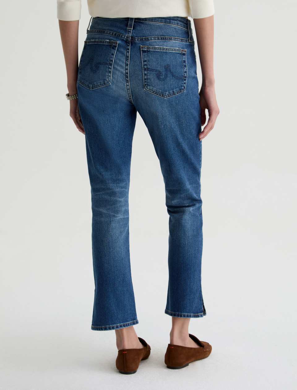 Back view of model wearing Mari Crop Jean in 15 Years Prague by AG Jeans.