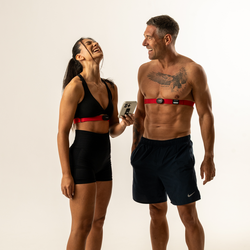 Couple wearing MYZONE Max heart rate monitor chest straps.