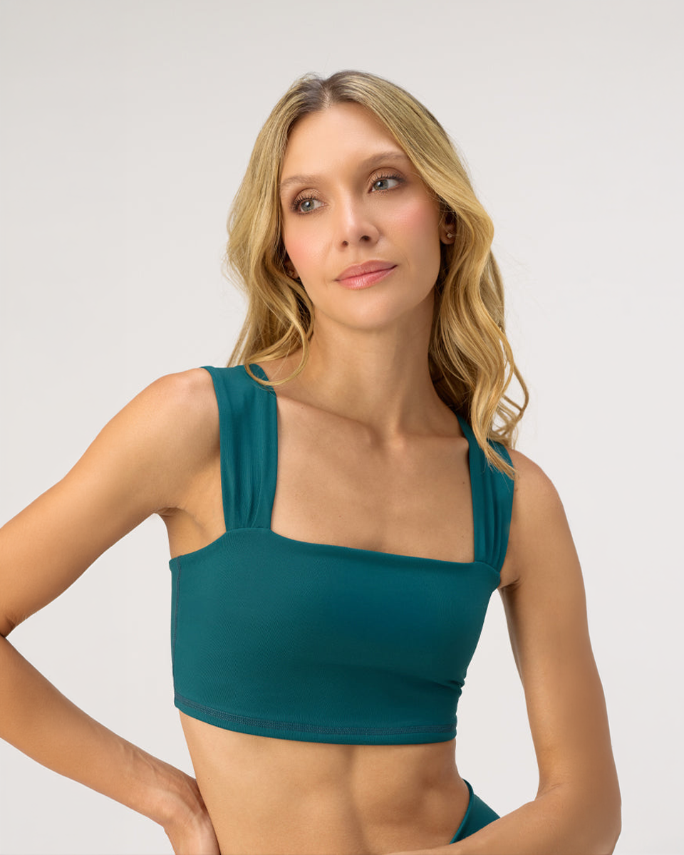 Model wearing the Glee x Be Fit Marine Jade Bra Top, front view.