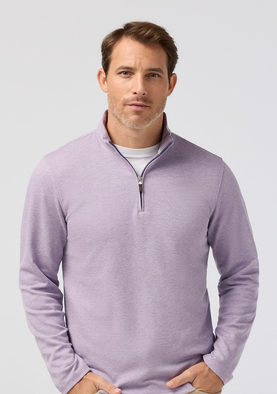 Front view of the Mizzen+Main KPI Quarter Zip in Purple Dusk Heather (lilac), highlighting the quarter-zip collar and heathered performance fabric.