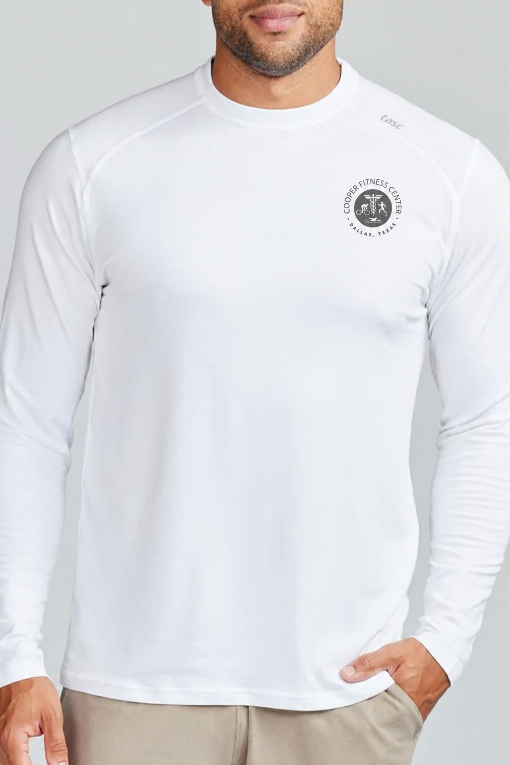 Front view of the Tasc Carrollton Fitness Long Sleeve T-Shirt in White, highlighting the embroidered Cooper Fitness Center logo and classic crew neckline.
