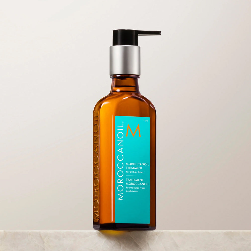 Amber glass bottle of Moroccanoil Treatment hair oil for all hair types, 3.4 fl oz.