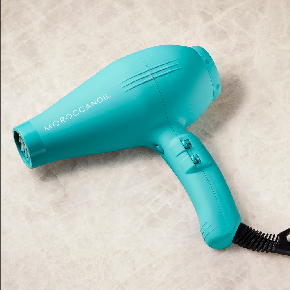 Turquoise Moroccanoil Power Performance Ionic Hair Dryer with adjustable heat and speed settings for fast, customizable hair drying and styling.